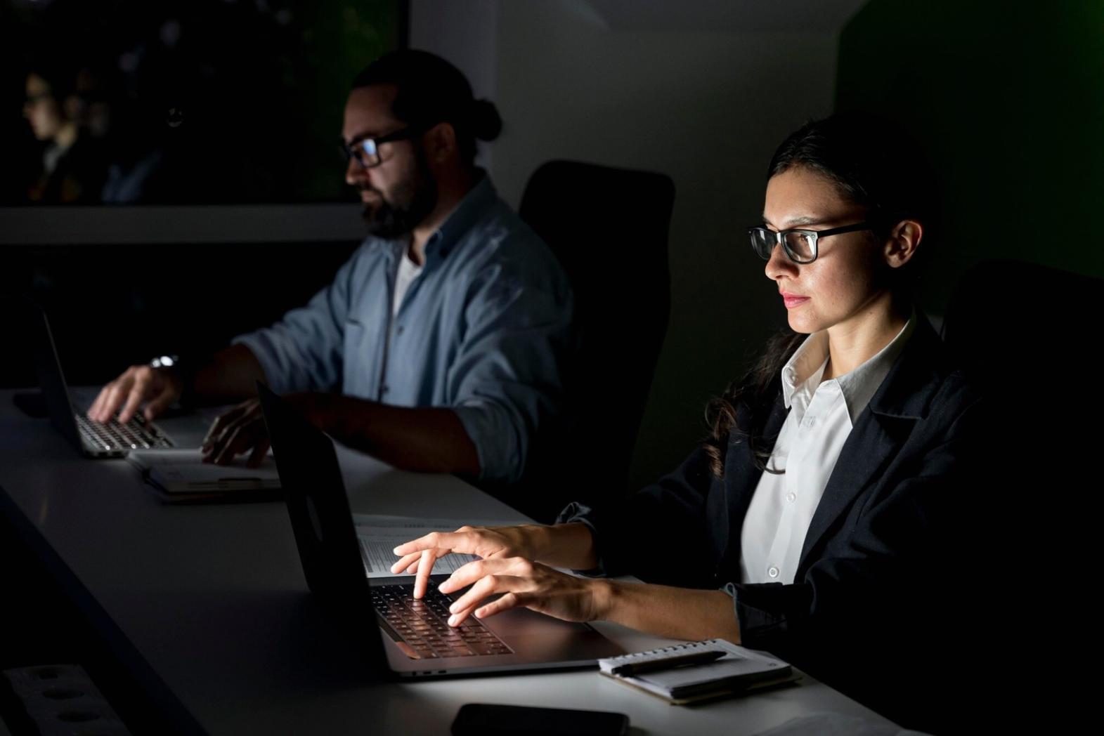 Financial analysis workshop with participants reviewing business documents and charts